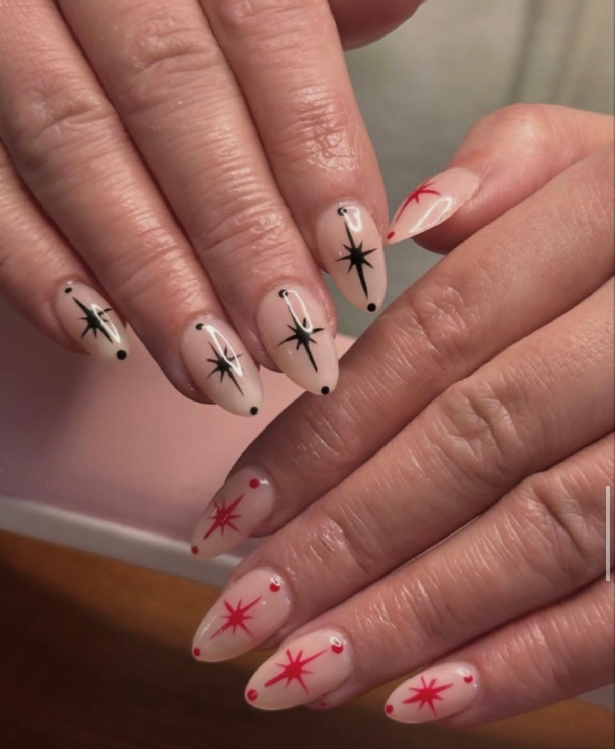 Retro red and black starburst nail art